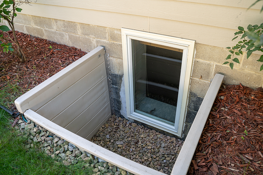 Exterior view of an egress window in a basement - Decatur, IL