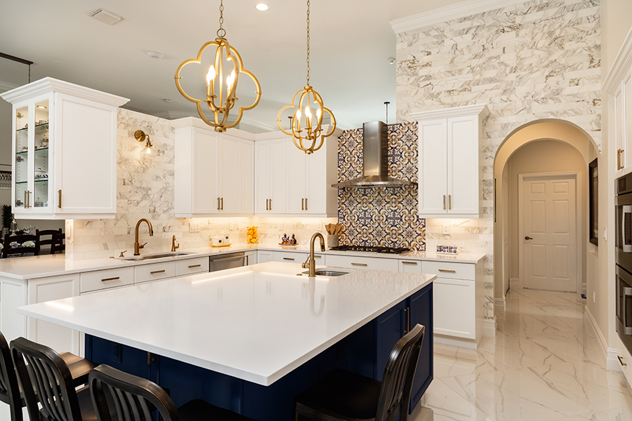 Beautiful luxury home kitchen with white cabinets and marble accents - Alton, IL